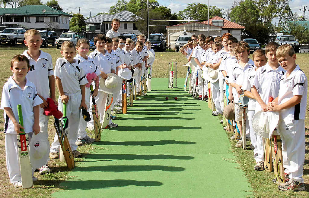 Warwick under-10 cricketers form a guard of honour in memory of the late Phillip Hughes.